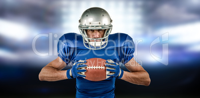 Composite image of portrait of confident sports player holding b