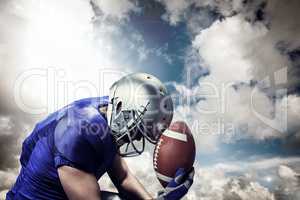 Composite image of upset american football player with ball