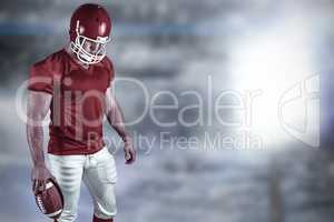 Composite image of american football player with ball