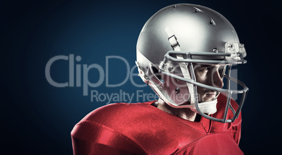 Composite image of confident american football player in red jer