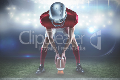 Composite image of full length of sports player placing the ball