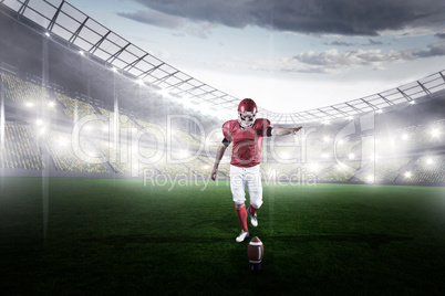 Composite image of american football player kicking football