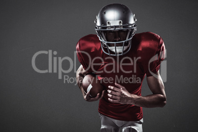 Composite image of american football player running with ball