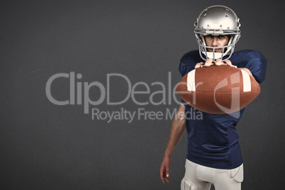 Composite image of portrait of american football player showing ball