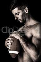Composite image of rugby player holding the ball while looking d