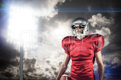 Composite image of american football player in red jersey lookin