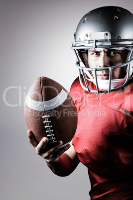 Composite image of portrait of determined american football play