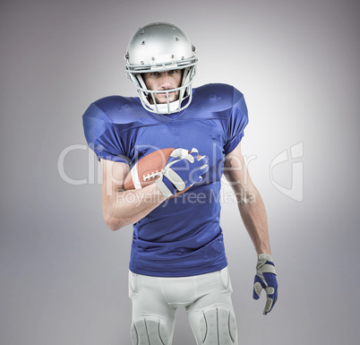 Composite image of portrait of confident american football playe