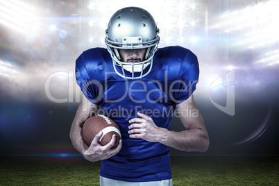 Composite image of confident sports player holding ball