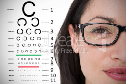 Composite image of pretty brunette wearing eye glasses