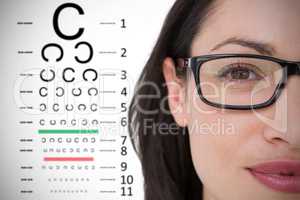 Composite image of pretty brunette wearing eye glasses