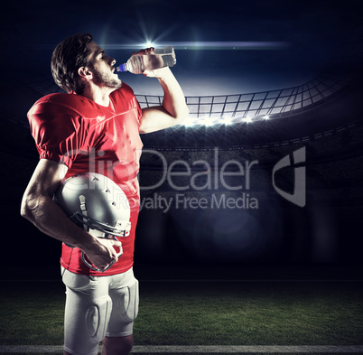 Composite image of thirsty american football player in red jerse