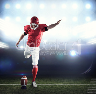 Composite image of american football player kicking football