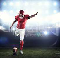 Composite image of american football player kicking football