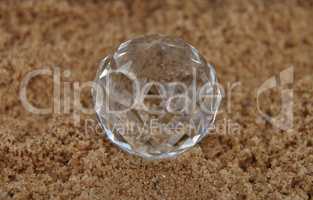 Glaskugel auf Sand