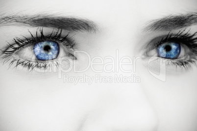 Composite image of blue eyes on grey face