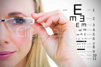 Composite image of close up of pretty blonde with reading glasse