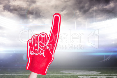 Composite image of american football player holding supporter fo