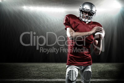 Composite image of confident american football player in red jer