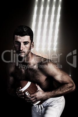 Composite image of portrait of shirtless rugby player posing wit