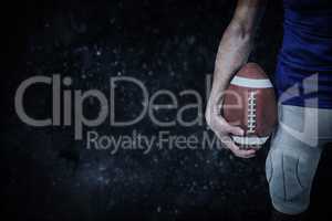 Composite image of sports player holding ball