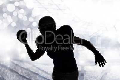 Composite image of silhouette sportsman throwing football