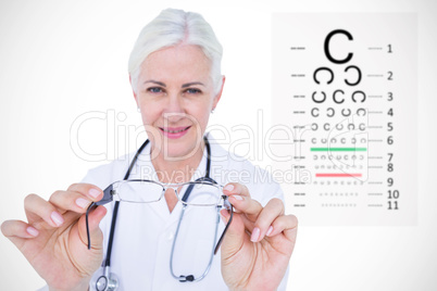 Composite image of smiling female optician presenting eye glasse