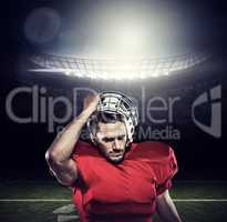 Composite image of american football player in removing helmet