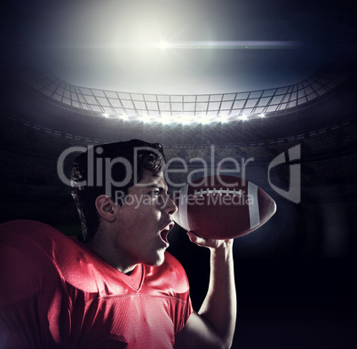 Composite image of aggressive sportsman with ball