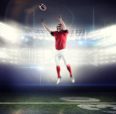 Composite image of american football player trying to catch foot