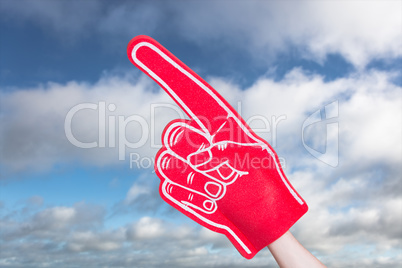 Composite image of american football player holding supporter fo