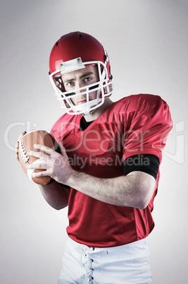 Composite image of portrait of american football player being ab