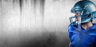 Composite image of sportsman with helmet looking away Composite image of sportsman with helmet looking away