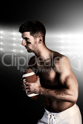 Composite image of shirtless rugby player holding the ball and f