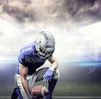 Composite image of american football player kneeling while holdi