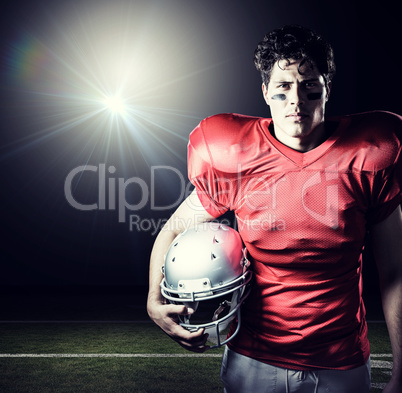 Composite image of portrait of determined sportsman holding helm