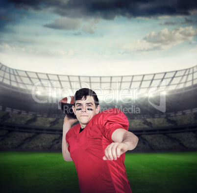 Composite image of american football player throwing a ball