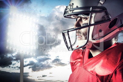 Composite image of side view of sportsman wearing helmet