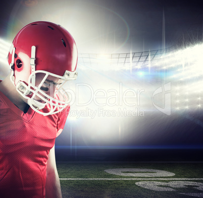 Composite image of amercian football player having his helmet on