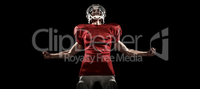 Composite image of aggressive american football player in red je