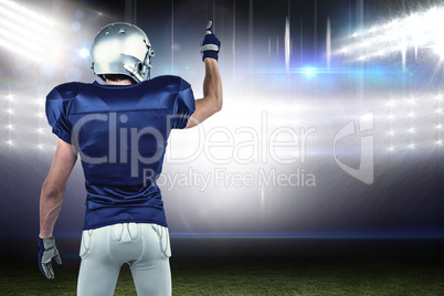 Composite image of rear view of sports player pointing