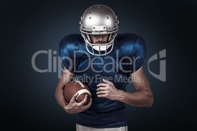 Composite image of confident sports player holding ball