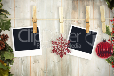 Composite image of hanging christmas photos