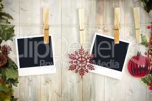 Composite image of hanging christmas photos