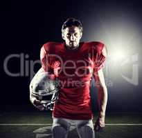 Composite image of american football player in red jersey holdin