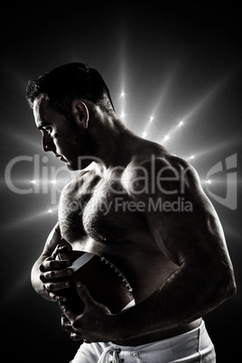 Composite image of shirtless american football player with ball