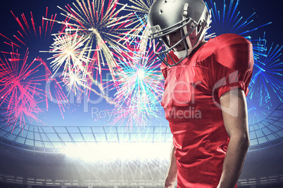 Composite image of american football player in red jersey lookin