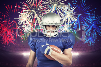 Composite image of portrait of american football player holding