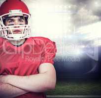 Composite image of american football player with arms crossed