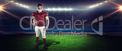 Composite image of american football player holding ball